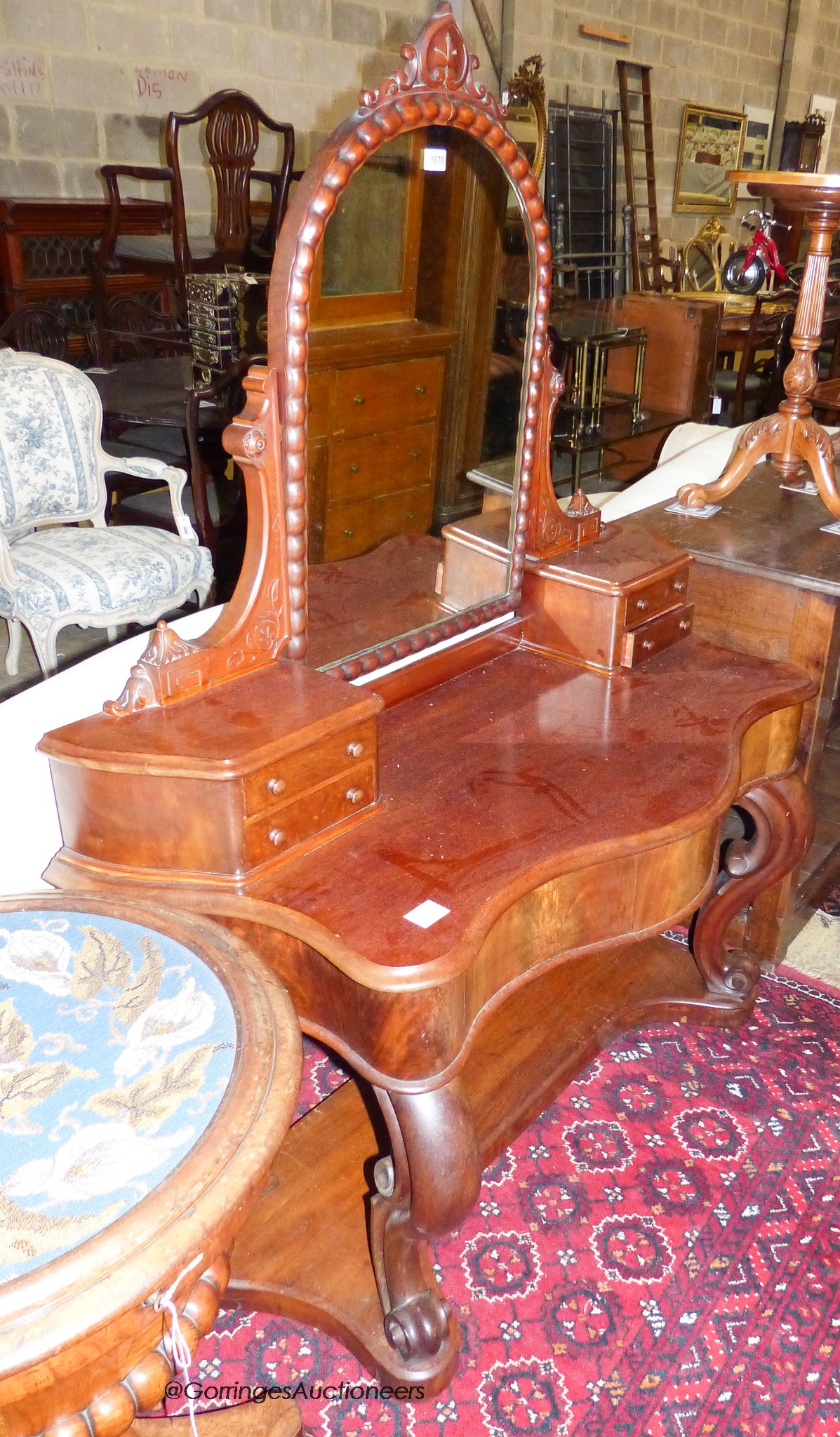 A Victorian mahogany duchess dressing table. W-120, D-54, H-154cm.
